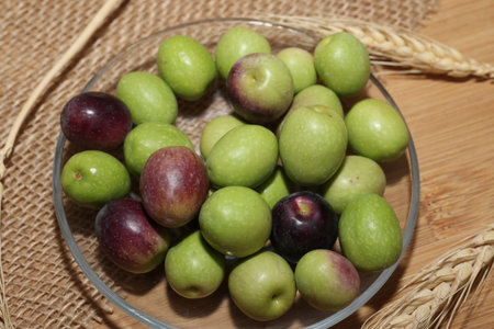 Olives and Olive Oil on wooden backgroundの写真素材
