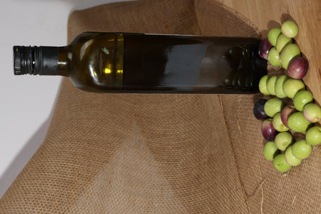 Olives and Olive Oil on wooden backgroundの写真素材