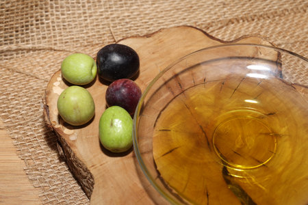 Olives and Olive Oil on wooden backgroundの写真素材