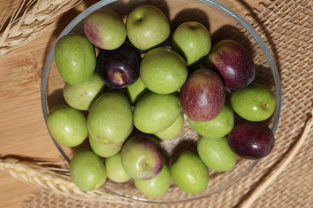 Olives and Olive Oil on wooden backgroundの写真素材