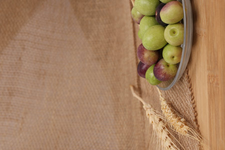 Olives and Olive Oil on wooden backgroundの写真素材