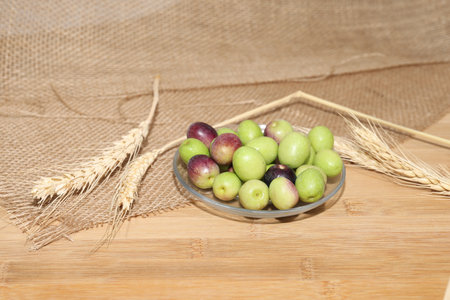Olives and Olive Oil on wooden backgroundの写真素材