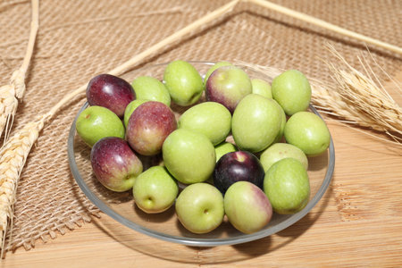 Olives and Olive Oil on wooden backgroundの写真素材