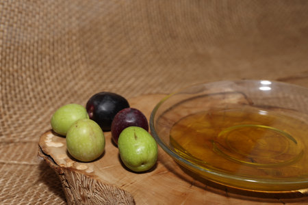 Olives and Olive Oil on wooden backgroundの写真素材