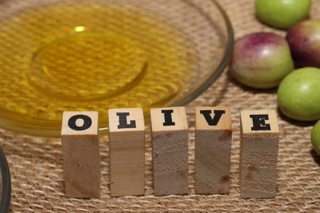 Olives and Olive Oil on wooden backgroundの写真素材