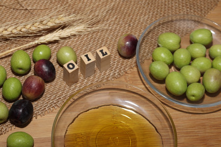Olives and Olive Oil on wooden backgroundの写真素材
