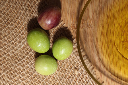 Olives and Olive Oil on wooden backgroundの写真素材