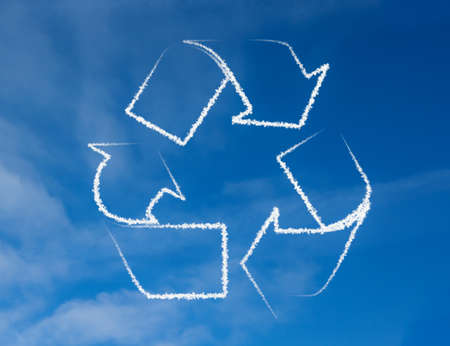 Recycling symbol from clouds in the skyの写真素材