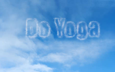 'Do Yoga' text from clouds in blue skyの写真素材