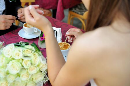 Two hands and cup of coffeeの写真素材