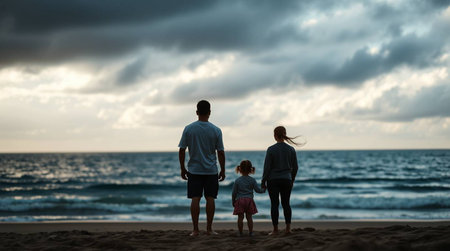 A loving family enjoying a breathtaking sunset on the beach. This image evokes feelings of warmth, connection, and the simple joys of life. Perfect for travel, family, and lifestyle themes. Use it for creating a sense of peace and happiness.の素材