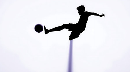 A striking silhouette captures the power and grace of a soccer player in action. Perfect for sports brands, fitness promotions, and motivational campaigns. Evokes energy, determination, and the thrill of competition. A versatile asset for design projects.の素材