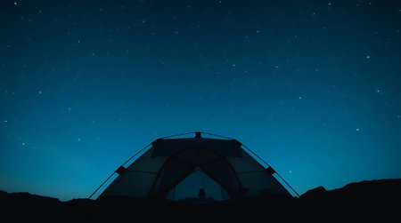 Experience ultimate tranquility camping under a breathtaking starry night sky. Embrace adventure and find peace in nature's serene embrace, perfect for outdoor escapes.の素材