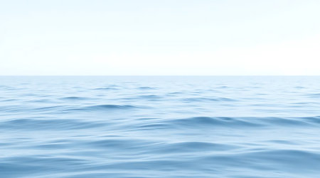 Experience ultimate tranquility with gentle ocean waves under a vast, clear sky. This serene seascape offers a peaceful escape, perfect for projects seeking calm and natural beauty.の素材