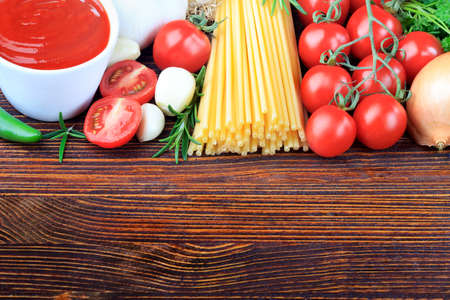 Food ingredients on an old brown wooden tableの写真素材