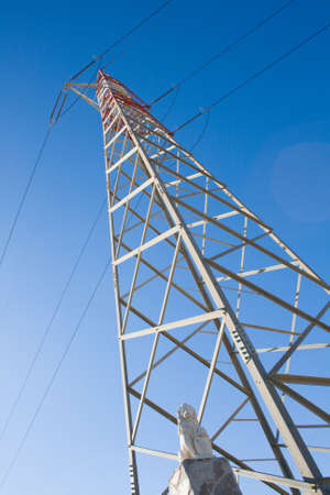 High voltage pylons with statue of lion