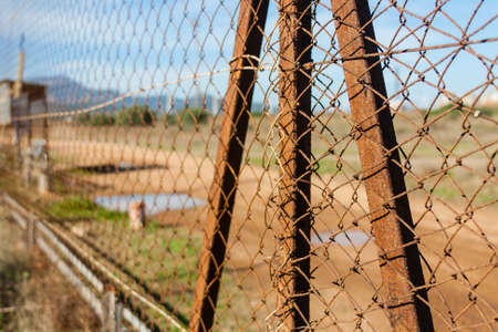 Rusted wire netting in industrial placeの写真素材