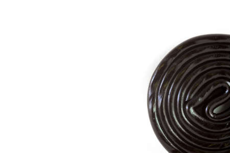 Rolled Liquorice. On the left with white background
