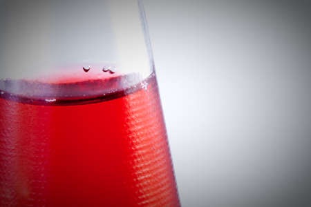 Red drink in the bootle. Bubbles .の写真素材