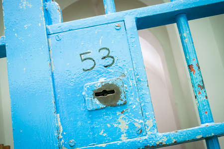 Blue lock in old prison. Lock number 53.のeditorial素材