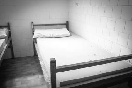 Old psychiatric hospital. Old bed in psychiatric wardの写真素材