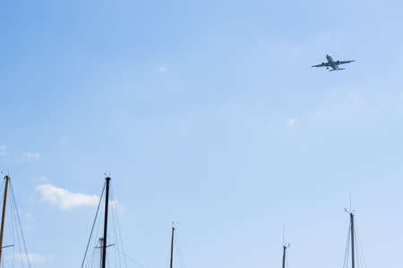Image of Plane lands with sailing mast in the lower partの写真素材