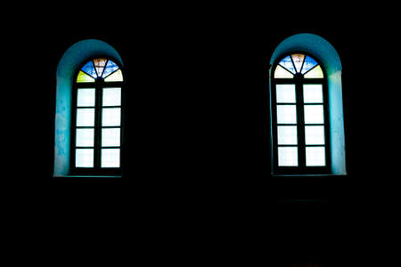 windows in the dark with colored glasses.の写真素材