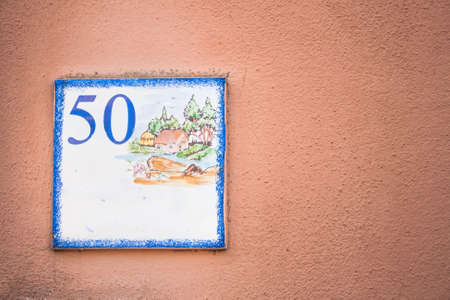 Street number 50. Particular of artistic street numberの写真素材