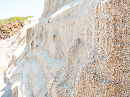 cliffs sand grains. In front of a mountain of sandの写真素材