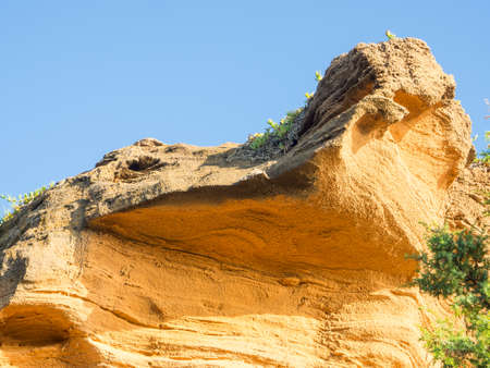 yellow rock sediments. Stratification of yellow stoneの写真素材
