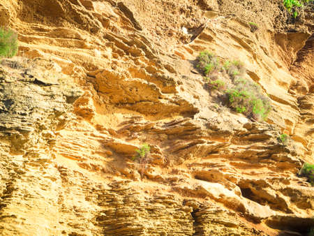 yellow rock sediments. Stratification of yellow stone