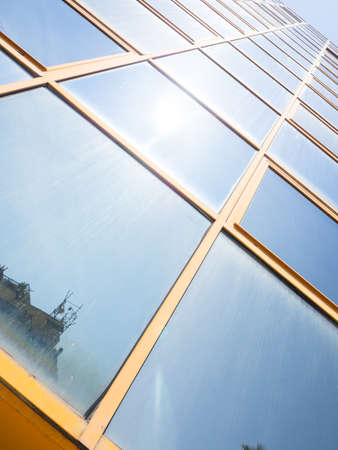 Glass reflection colored. Reflection in glass office buildingの写真素材