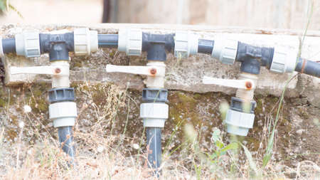 three faucet lined. complex of three pipelines and valvesの写真素材