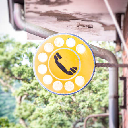 telephone signboard service. Retro sign that indicate a pubblic telephone in Italyの写真素材