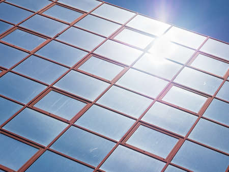 Glass reflection colored. Reflection in glass office buildingの写真素材