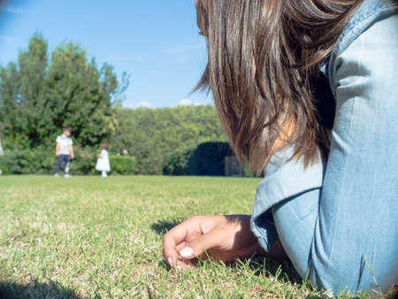 Mom check their childrens playing. Relax moment with mom that look at their childrensの写真素材