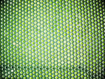 many holes on the iron. Background of many holes