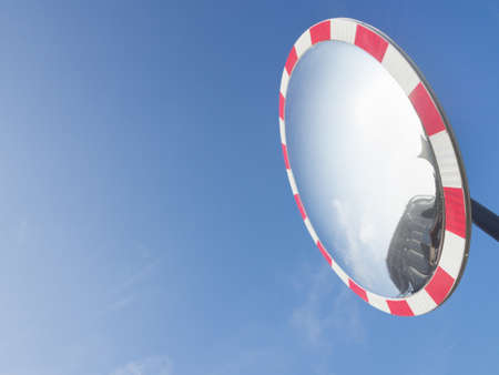 Sky reflection glass. Particular of a round glass, used on the roadの写真素材