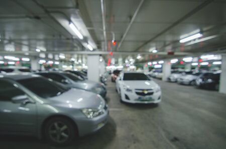 Abstract blur parking car indoor for background, Color tone effect.の写真素材