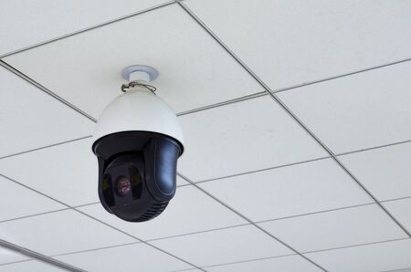 CCTV security camera installed wall ceiling, security camera system concept.の写真素材