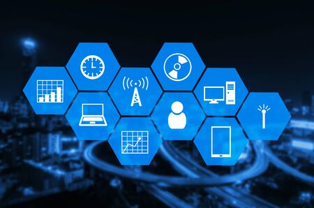 technology device icon and hexagon shaped pattern design for abstract technology background on blurred night city background.の写真素材