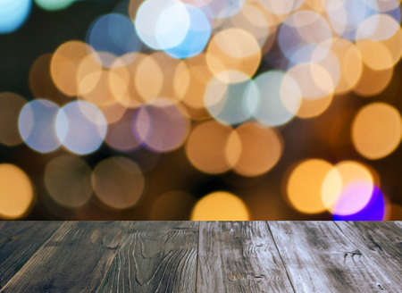 vintage wood terrace or wooden floor with abstract blurred background of colorful light bokeh effect for background.の写真素材