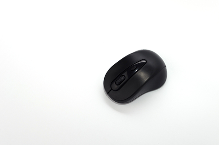 wireless black computer mouse on white backgroundの写真素材