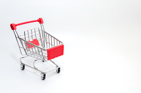 Mini supermarket shopping cart on white backgroundの写真素材
