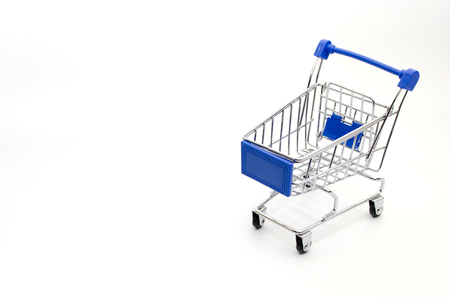 mini supermarket shopping cart blue color on white background, holiday sale and online shopping concept, selective focus, copy spaceの写真素材