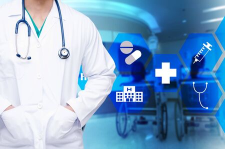 smart doctor with a stethoscope around his neck on blurred image of empty chairs in waiting room at hospital and medical icon in hexagon shaped pattern design, healthcare medical technology conceptの写真素材