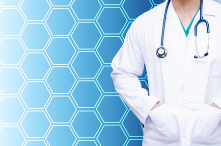 smart doctor with a stethoscope around his neck on hexagon shaped pattern design background, healthcare medical technology concept, color effect tone, copy spaceの写真素材