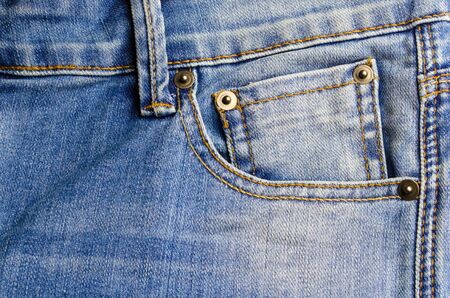 close up view of front pocket vintage blue denim jeans pant fashion, texture background, selective focusの写真素材