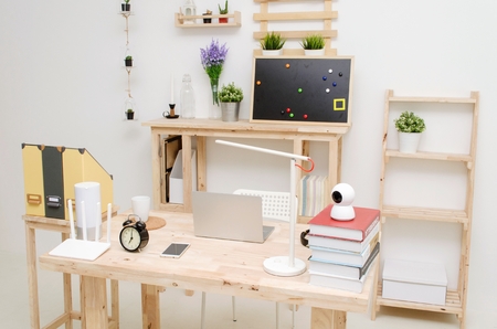 modern interior office room working space with laptop computer wooden desk and gadgets accessories...