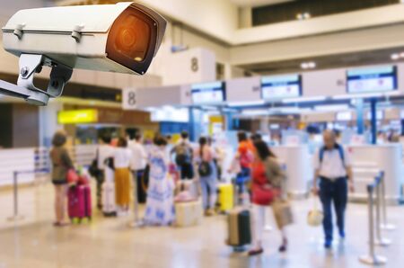 CCTV, security camera system operating record and property protection with blurred image of people waiting check in counter at airport, surveillance security technology and transportation conceptの写真素材
